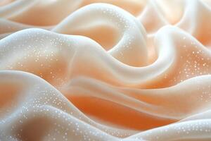 Delicate peach silk with shimmering accents flowing elegantly in soft waves. photo