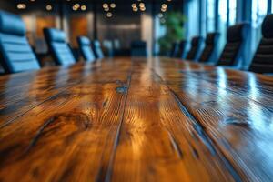 A polished wooden conference table in a modern boardroom setting, reflecting soft lighting from above. photo