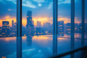 A stunning city skyline at dusk, showcasing vibrant hues of orange and blue reflected on a glass surface. photo