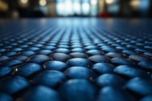 Close-up of a textured blue surface with raised circular patterns, creating a modern and artistic ambiance. photo