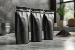 Three sleek black packaging bags lined up on a modern countertop, creating a minimalist aesthetic. photo