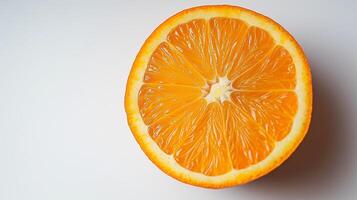 A vibrant orange slice showcasing its juicy texture and bright color against a clean background. photo