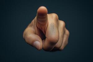 A close-up of a male hand pointing directly at the viewer, conveying a sense of urgency and emphasis. photo