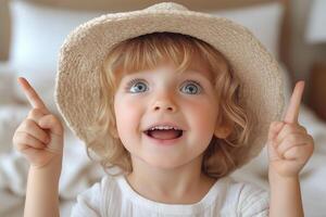 A joyful Caucasian girl in a straw hat, smiling with wide eyes while pointing up, capturing a moment of delight. photo