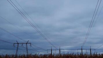 Clouds running over high voltage power lines towers time lapse video