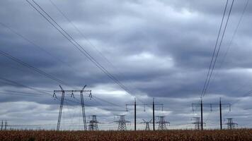 Time lapse of pylons of high voltage power line under running clouds video
