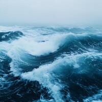A large ocean wave with a dark sky photo