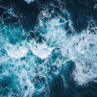 An aerial view of the ocean with waves photo