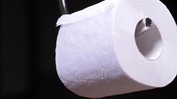 replacing an empty roll on a holder with a new roll of toilet paper video
