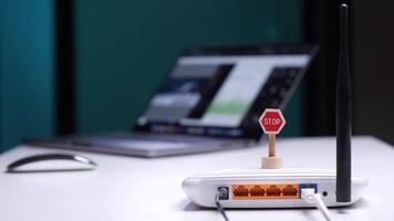 Technician placing stop sign on wi-fi router to stop internet access video