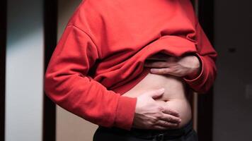 Man suffering from abdominal pain, touching belly with hands video