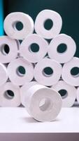 vertical toilet paper roll on a background of a stack of toilet paper. background video