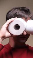vertical Man using toilet paper rolls as binoculars. having fun at home video