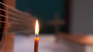 Candlelight and guitar strings in soft focus video