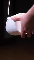 vertical replacing an empty roll on a holder with a new roll of toilet paper video