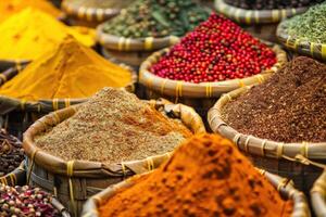 spice market with colorful piles of spices and herbs in woven baskets photo