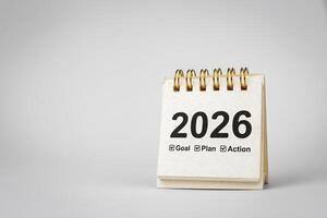 Calendar page of 2026, white on white background with copy space and business design. Concepts of planning for success, setting goals, planning strategies and taking action steps. photo
