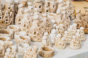 A table with many ceramic figurines on it photo