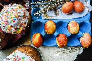 Easter eggs decorated with colorful sprinkles and decorated with a flower photo