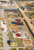 A construction site with a playground and a building photo