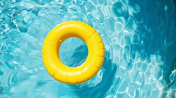 Inflatable ring floating in swimming pool with blue water background. photo