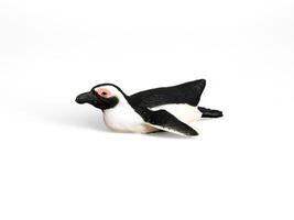 A penguin toy on a white background photo