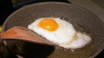 An egg being cooked in a frying pan video