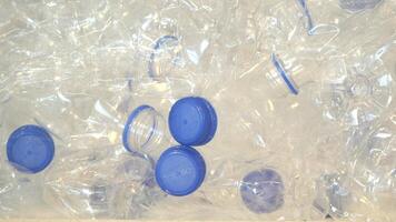 Discarded plastic bottles and caps collected for recycling efforts video