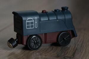 This is a Vintage Toy Train Engine crafted in elegant Dark Blue and Brown Colors, perfect for play photo