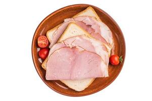 Ham sandwich, toast with sliced Prosciutto Cotto isolated on white background. top view photo
