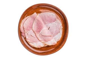 Sliced pork ham for sandwiches, smoked meat isolated on white background. top view photo