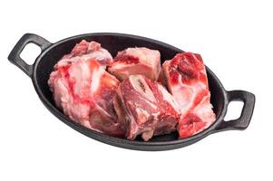 Raw chopped lamb meat with bones, uncooked mutton isolated on white background. top view photo