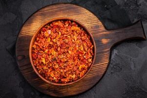 Dried and chopped Tomato for cooking. black background. top view photo