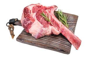 Raw Tomahawk beef steak, fresh black angus ribeye with bone on wooden board Isolated on a white background. top view photo