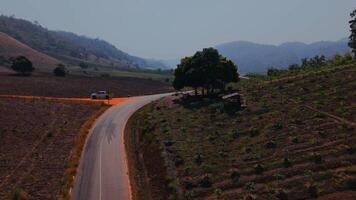 Experience the twists and turns of a mountain road carved through a desolate, dry landscape. The stark beauty of the barren peaks and rugged terrain makes this road an adventure of its own. video