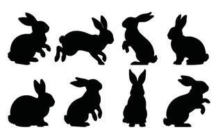 Set of rabbit silhouettes in various poses. Hand drawn black Easter bunny silhouettes isolated on a white background. Perfect decorative elements for design. vector