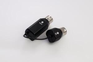 Close-Up of MIDI Cable Connectors with IN and OUT Labels on White Background photo