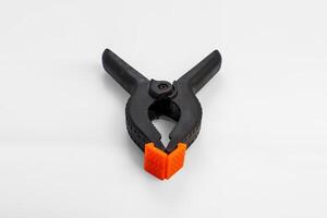 Black Spring Clamp with Orange Pads photo