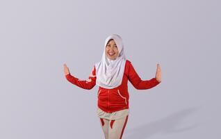 Smiling Muslim Woman in Red Sportswear with Open Hands on Minimalistic Background photo