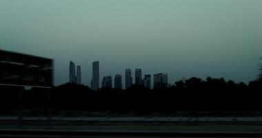 Panoramic view of the metropolis with modern skyscrapers. from a moving car window, general view of the city video