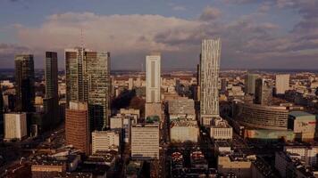 View of the modern metropolis from a bird's eye view. footage from a drone, aerial view of modern glass skyscrapers and streets with busy traffic, with beautiful daylight. video
