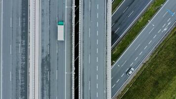 Close-up of details of a road junction with passing cars, top view. Multi-level road, filming from a quadrocopter. video
