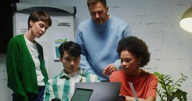 Working together to create a business plan for a startup. Young talented entrepreneurs work as a team, discussing project details video
