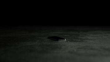 A single-color screen lights up on a phone lying on a dark surface. Animated graphic for demonstration video