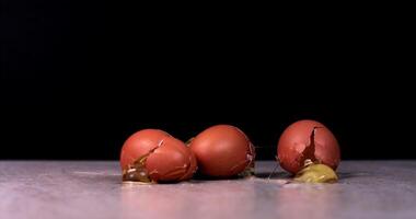 A chicken eggs fall and break, spreading over a light surface video