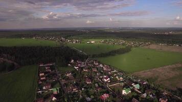 Flying over vast green rural areas and villages, Russia video