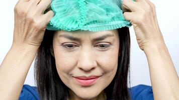 Health worker and teaches how to wear a mask to prevent virus concept. Smiling beautiful Asian female nurse video
