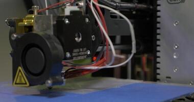 3D printing in process with plastic wire filament on 3D printer video