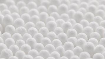 closeup spinning fullframe macro background of cotton earbud heads video