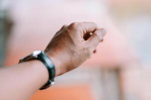 Wristwatch detail emphasizing timeliness and precision of hand gesture photo